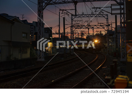Twilight cityscape / curve through which the railroad passes Twilight cityscape / curve through which the railroad passes 72945194