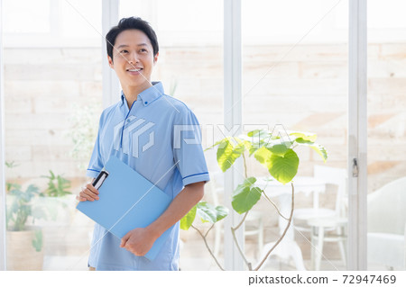 Portrait of a male caregiver 72947469
