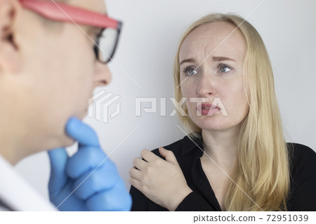 A woman suffers from shoulder pain. Shoulder injury, tendonitis, sprain, or tendon inflammation. The concept of acute pain and inflammation in different parts of the body. On examination by a doctor A woman suffers from shoulder pain. Shoulder injury, tendonitis, sprain, or tendon inflammation. The concept of acute pain and inflammation in different parts of the body. On examination by a doctor 72951039