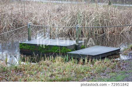 Wooden raft in the water Wooden raft in the water 72951842