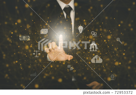 Businessman Touching in line graph Screen Icon of a media screen on the tablet screen in a black background. Technology Process System Business concept. 72953372