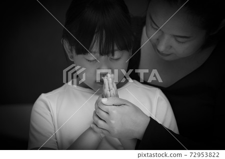Asian face woman and child praying and worship to GOD Using hands to pray in religious beliefs and worship christian in the church or in general locations in While and Black background Asian face woman and child praying and worship to GOD Using hands to pray in religious beliefs and worship christian in the church or in general locations in While and Black background 72953822