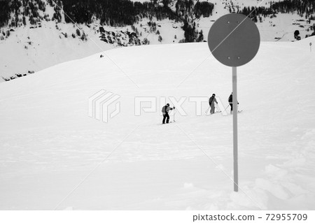 Marker on off-piste snowy slope for freeriding in high winter mountains Marker on off-piste snowy slope for freeriding in high winter mountains 72955709