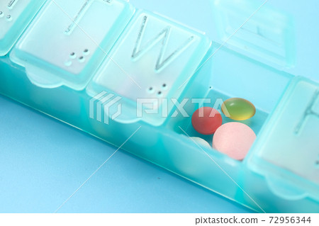 close up of pills and capsule in a pill box close up of pills and capsule in a pill box 72956344