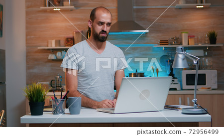 Man discussing on video call working from home 72956499
