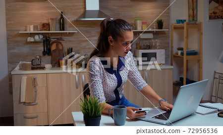 Woman using credit card for shopping online Woman using credit card for shopping online 72956536