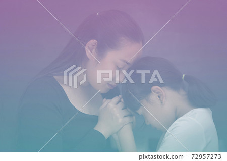 Asian face woman and child praying and worship to GOD Using hands to pray in religious beliefs and worship christian in the church or in general locations in While and Black background Asian face woman and child praying and worship to GOD Using hands to pray in religious beliefs and worship christian in the church or in general locations in While and Black background 72957273