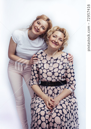 mother with teen daughter together posing happy smiling isolated on white background with copyspace, lifestyle people concept 72957416