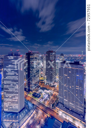 Night view of the city lined with skyscrapers Night view of the city lined with skyscrapers 72957931