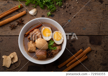 Egg and Pork in Sweet Brown Sauce ,Kai Pa Lo in white bowl. Egg and Pork in Sweet Brown Sauce ,Kai Pa Lo in white bowl. 72958355