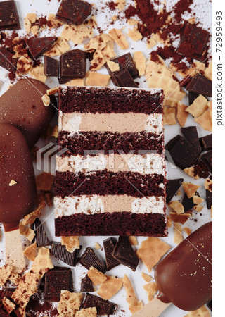 Slice of cake in the section on the background of chocolate 72959493