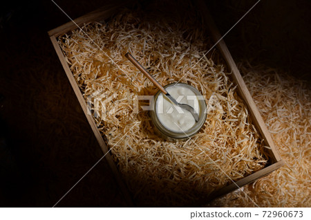 Bowl of white yoghurt and spoon Bowl of white yoghurt and spoon 72960673