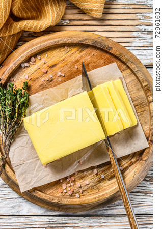 Farm Butter, organic dairy products. White wooden background.Top view Farm Butter, organic dairy products. White wooden background.Top view 72961632