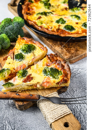Homemade quiche tart with red fish and broccoli. White background. Top view 72962644