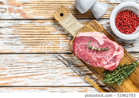 Raw beef meat Club or striploin on the bone steak. White wooden background. Top view. Copy space Raw beef meat Club or striploin on the bone steak. White wooden background. Top view. Copy space 72962783
