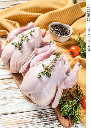 Fresh Raw chicken with spices, cooking background. White background. Top view Fresh Raw chicken with spices, cooking background. White background. Top view 72963314
