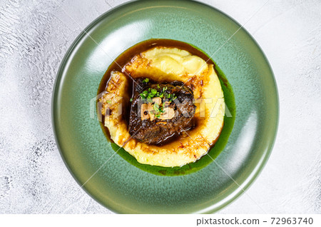 Beef sirloin fillet steak with a side dish of mashed potatoes. Gray background. Top view. Copy space 72963740