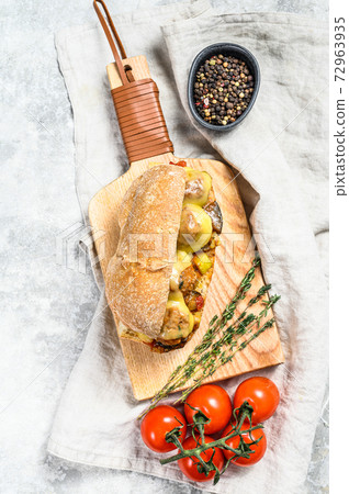 Submarine sandwich with meatballs. Gray background. Top view Submarine sandwich with meatballs. Gray background. Top view 72963935
