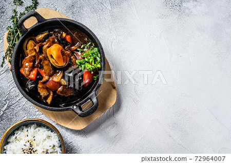 Beef meat in teriyaki sauce with rice. White background. Top view. Copy space Beef meat in teriyaki sauce with rice. White background. Top view. Copy space 72964007