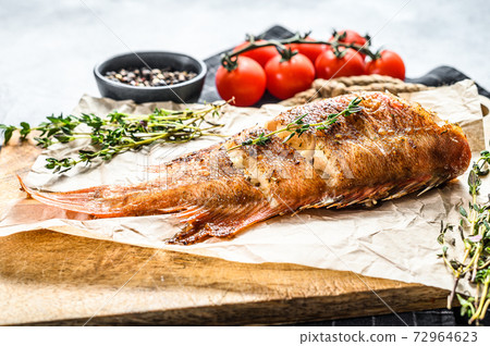 Red sea perch grilled. Gray background. Top view Red sea perch grilled. Gray background. Top view 72964623