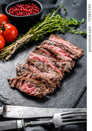 Grilled sliced skirt steak with seasonings and Grilled sliced skirt steak with seasonings and 72965194