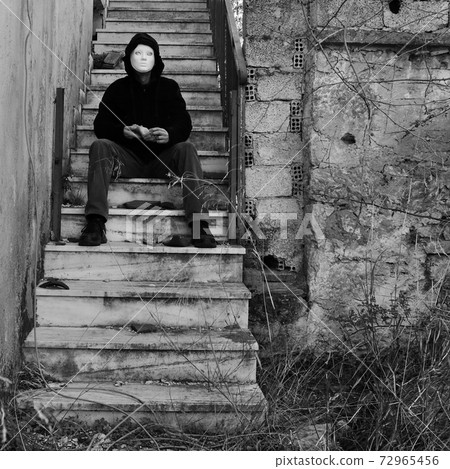 masked figure with doll hand masked figure with doll hand 72965456