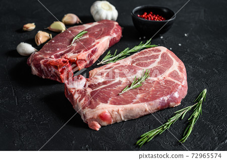 Fresh pork steak. Marbled meat. Black background. 72965574