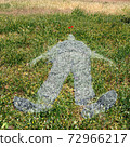 human figure imprinted on grass 72966217