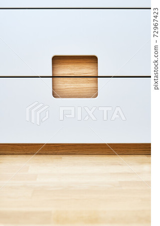 Modern wardrobe with finger pull design. Wooden wardrobe with light gray cabinet doors. Modern furniture Modern wardrobe with finger pull design. Wooden wardrobe with light gray cabinet doors. Modern furniture 72967423