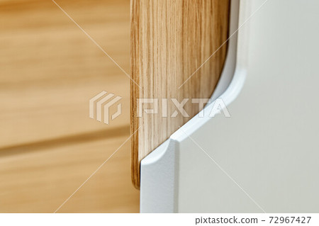 Modern wardrobe with finger pull design. Wooden wardrobe with light gray cabinet doors. Modern furniture 72967427