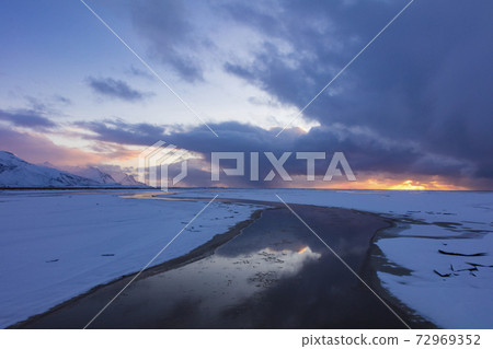 Iceland River leading into the distant sunset 72969352