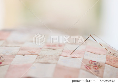 Quilt handmade craft with a needle 72969658