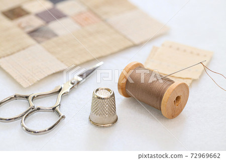 Quilt handmade craft accessories on white fabric Quilt handmade craft accessories on white fabric 72969662