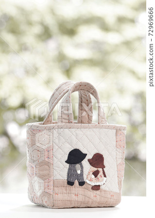 Quilt bag handmade craft on garden background Quilt bag handmade craft on garden background 72969666