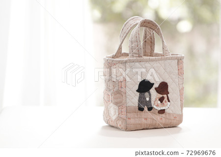 Quilt bag handmade craft on garden background Quilt bag handmade craft on garden background 72969676