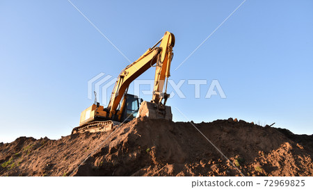 Excavator working at construction site.  72969825