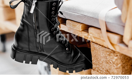 women's shoes on a stand on wooden platform 72970053