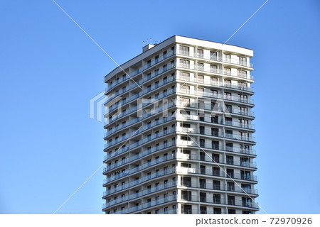 Facade of a new modern high-rise residential building.  72970926