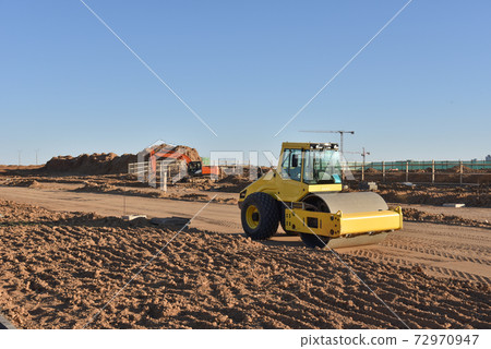 Soil Compactor the leveling soil at construction site.  72970947