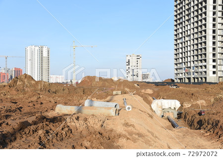 Tower cranes constructing a new residential build. Tower cranes constructing a new residential build. 72972072