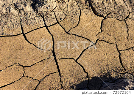 Dry lake or swamp in the process of drought and lack of rain or moisture, a global natural disaster 72972104