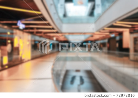 Mall people blurred background. Interior of retail centre store in soft focus. People shopping in modern commercial mall center. Sale, consumerism and people concept. 72972816