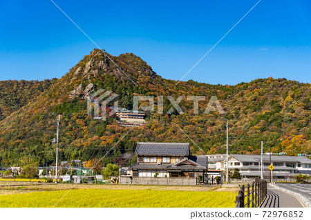 Higashiomi City, Shiga Prefecture, a distant view of Tarobogu, which has colored leaves all over the mountain Higashiomi City, Shiga Prefecture, a distant view of Tarobogu, which has colored leaves all over the mountain 72976852
