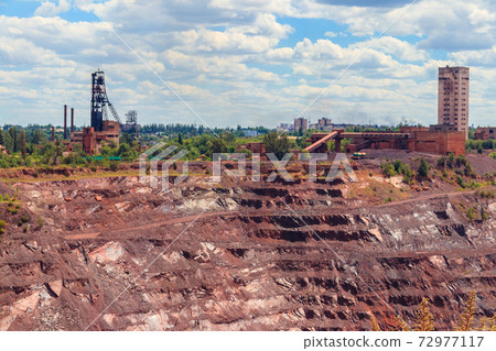 View of huge iron ore quarry in Kryvyi Rih, Ukraine. Open pit mining View of huge iron ore quarry in Kryvyi Rih, Ukraine. Open pit mining 72977117