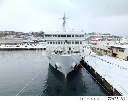 Taking a picture of the snow scene of the Okushiri ferry preparing for departure at Esashi Port, Esashi Town, Hokkaido in winter 72977484