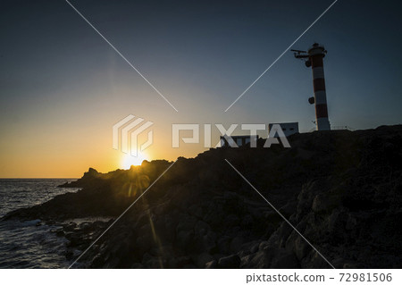 Beautiful scenic landscape with classic lighthouse and golden sunset in background - concept of travel and scenic place. for tourism Beautiful scenic landscape with classic lighthouse and golden sunset in background - concept of travel and scenic place. for tourism 72981506