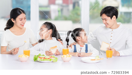 Family eating breakfast Family eating breakfast 72983394