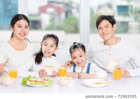 Family eating breakfast Family eating breakfast 72983395