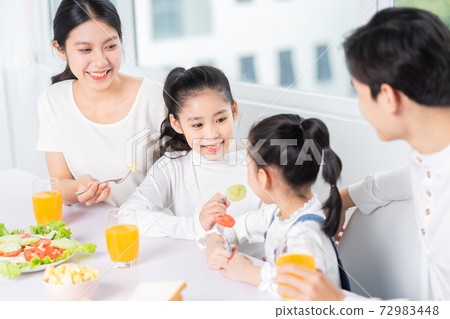 Family eating breakfast Family eating breakfast 72983448