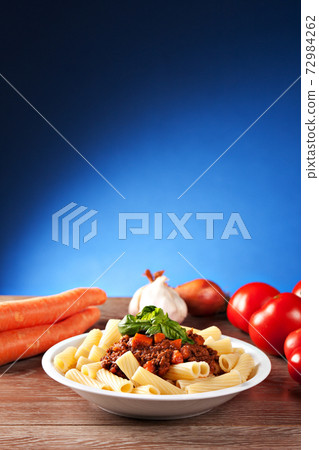 Macaroni Bolognese on a plate. Typical Italian dish. Macaroni Bolognese on a plate. Typical Italian dish. 72984262